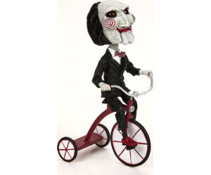 Figura neca saw head knocker puppet on tricyclesue)